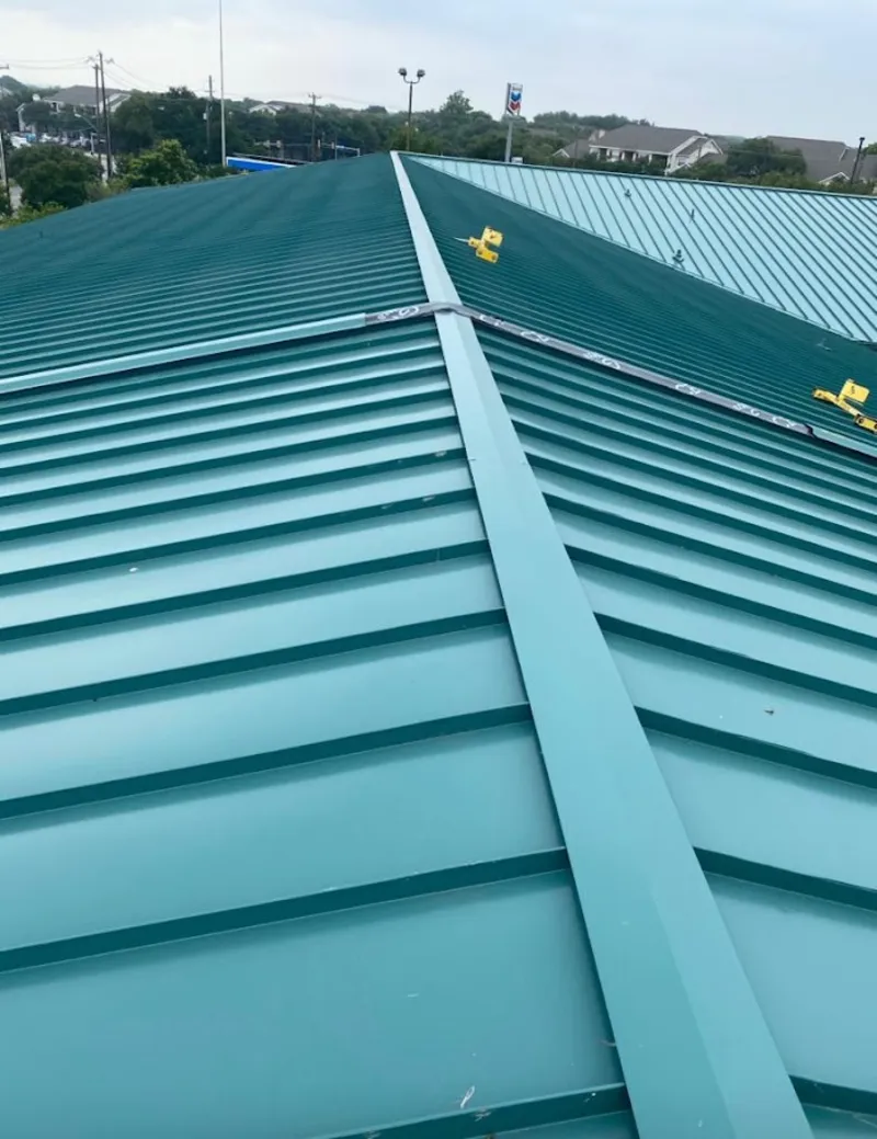 Green commercial metal roof ridge and valley for Metal Roof Repair in Idaho Falls