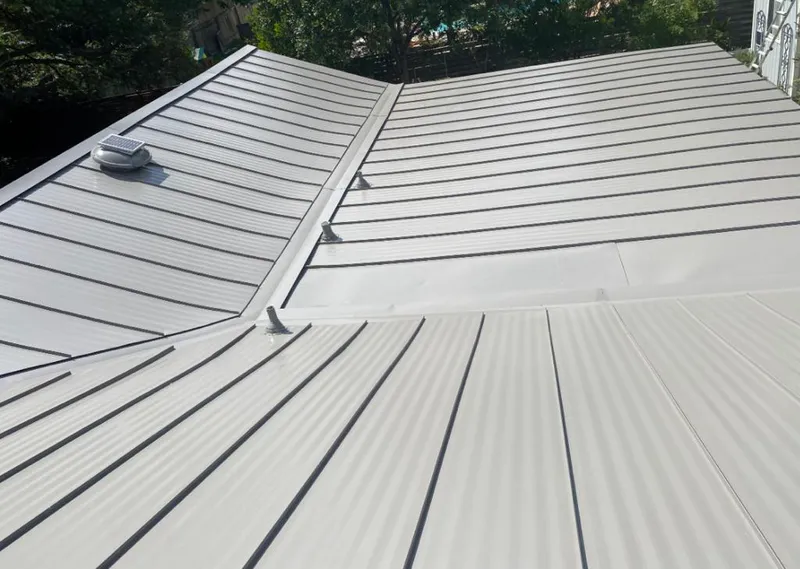 Solar attic fan installed on a metal roof for Roof Ventilation in Idaho Falls